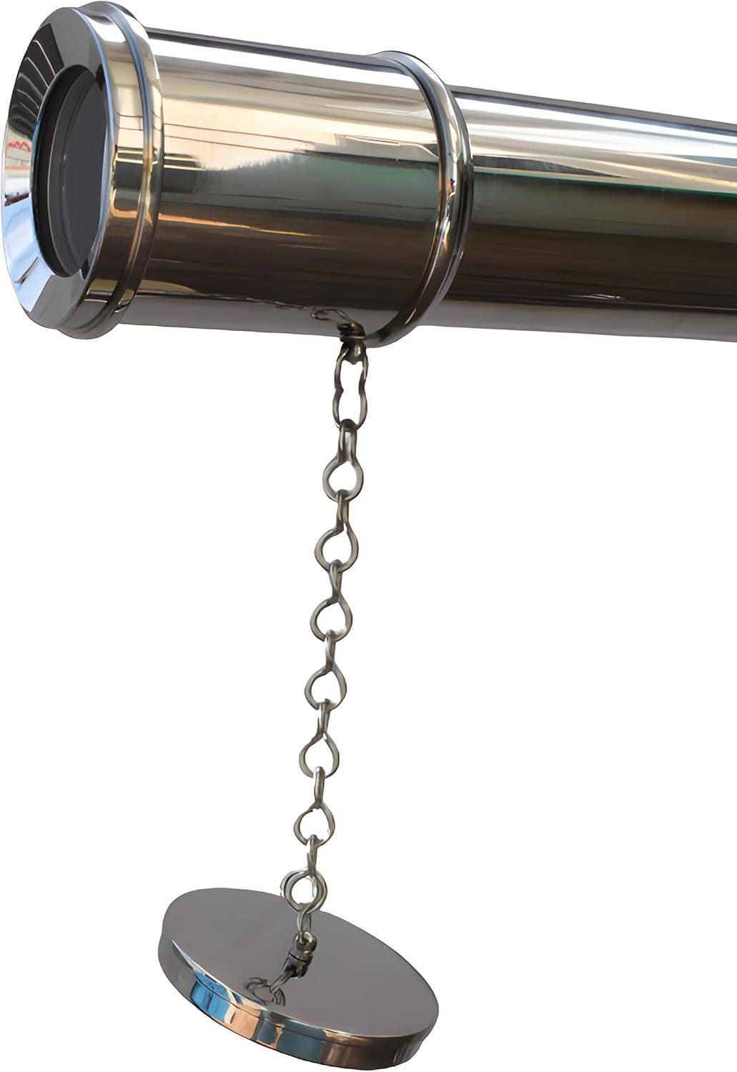 May include: A polished, chrome-finished telescope with a lens at one end. A small chain is attached to the telescope and leads to a circular cap. The telescope is designed for viewing distant objects.