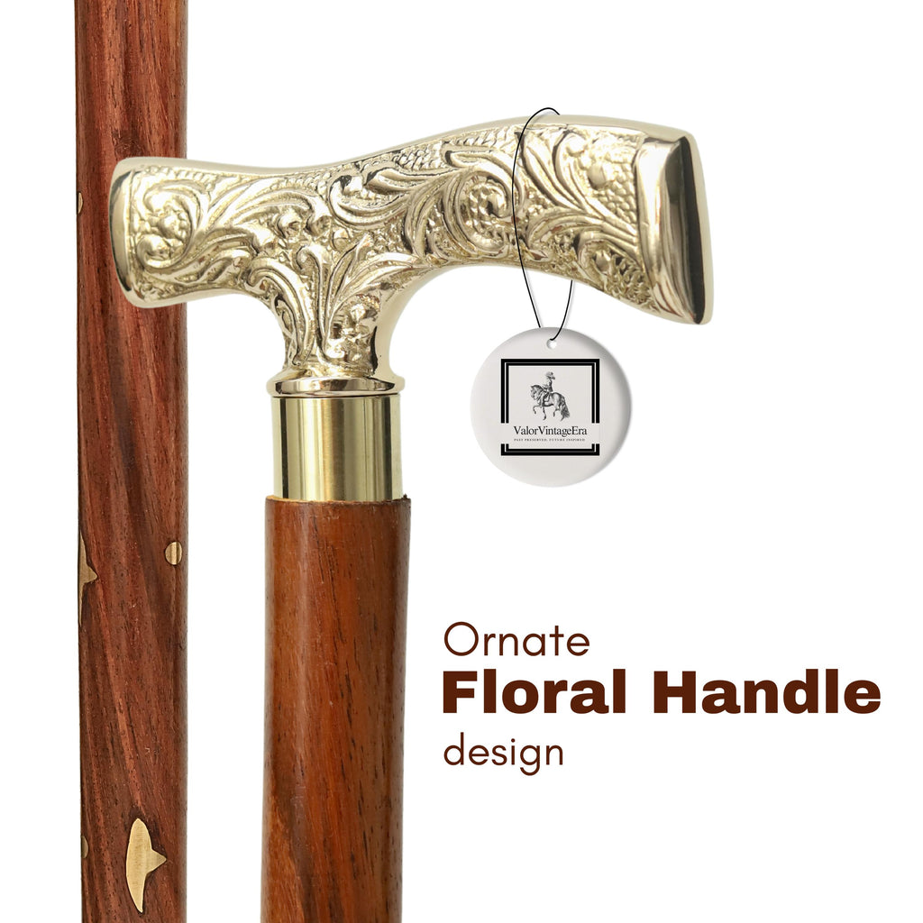 May include: A close-up of a walking stick with an ornate, gold-coloured floral handle. The handle is T-shaped and attached to a dark brown wooden shaft. The text "Ornate Floral Handle design" is visible.